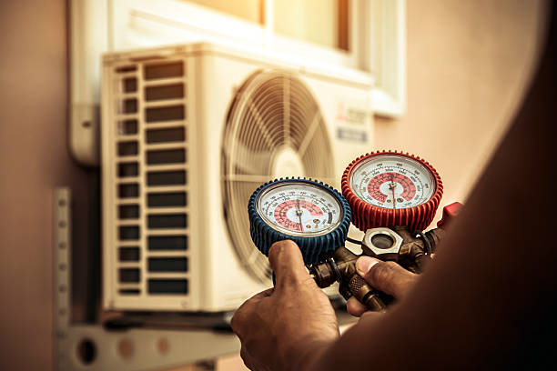 Professional Air Conditioning Service technician working in Magnolia, DE